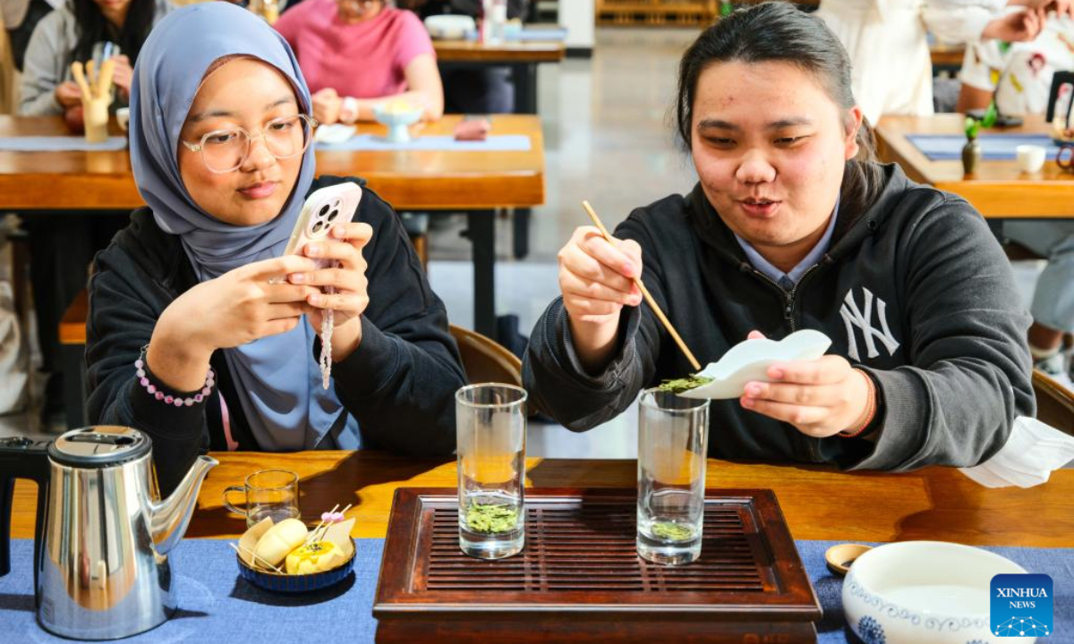 Students from University of Malaysia Sarawak (UNIMAS) learn to make tea at Vocational and Technical College of Inner Mongolia Agricultural University in Baotou, north China's Inner Mongolia Autonomous Region, May 9, 2025. A total of 21 UNIMAS students on Friday attended here hands-on studio workshops featuring traditional Chinese culture and technical training. (Xinhua/Ma Jinrui)
