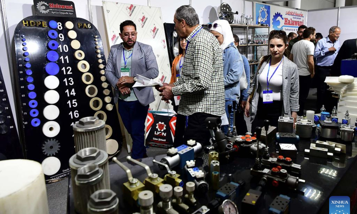 Attendees browse industrial components and mechanical fittings during the Techno Build exhibition in Damascus, Syria, May 10, 2025. The fair, showcasing a wide range of services and solutions for building, construction and infrastructure, drew more than 500 local and international companies. (Photo by Ammar Safarjalani/Xinhua)