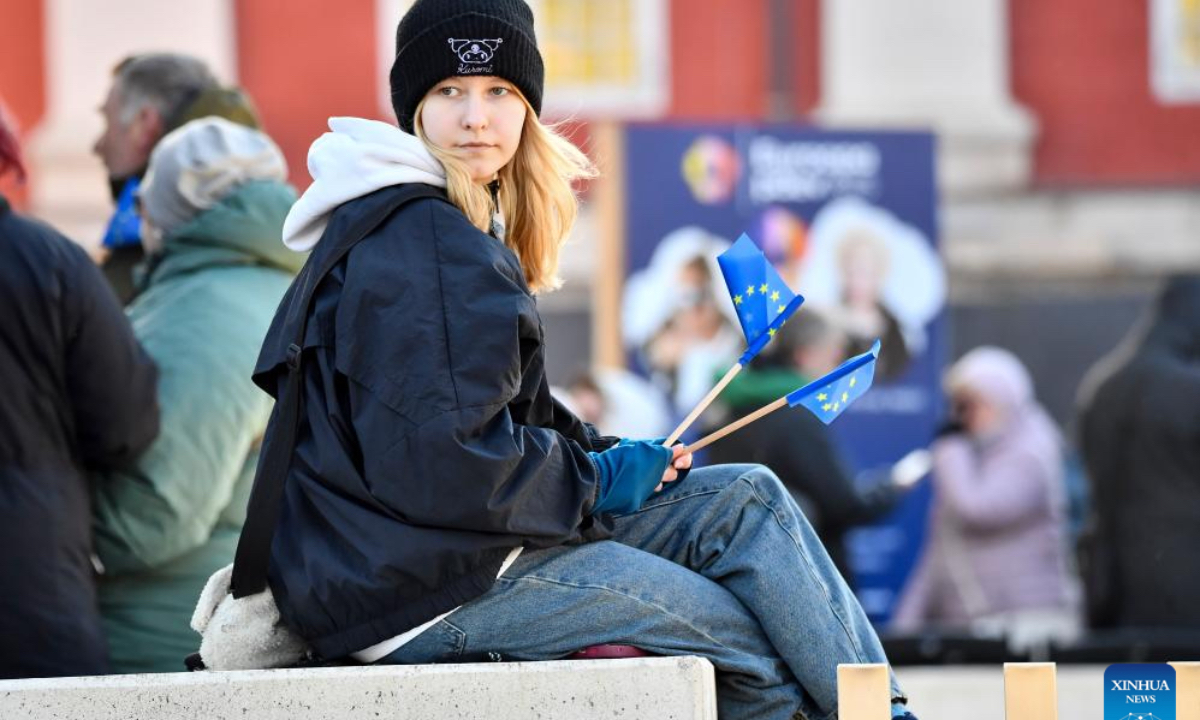 A girl watches a concert during a Europe Day celebration event in Narva, Estonia, May 9, 2025. (Photo: Xinhua)
