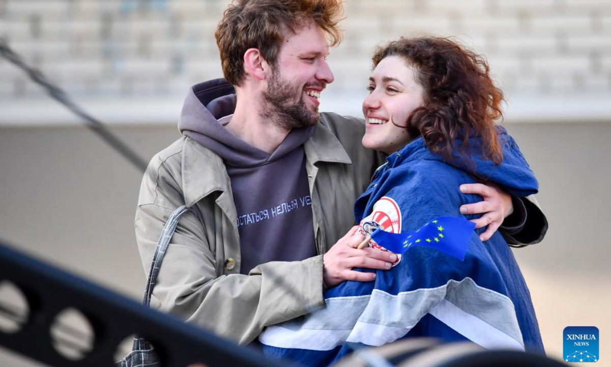 A couple watches a concert during a Europe Day celebration event in Narva, Estonia, May 9, 2025. (Photo: Xinhua)