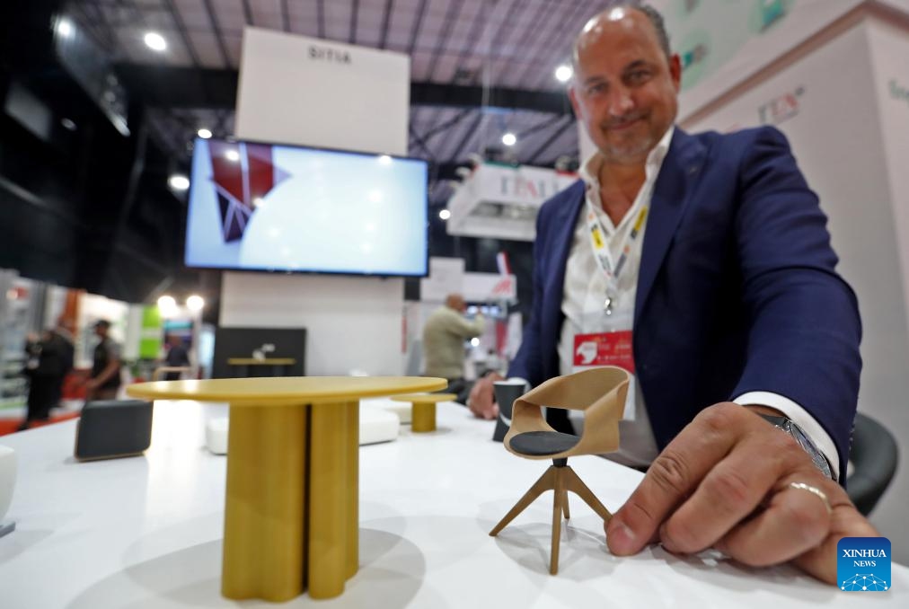 An exhibitor displays mini furniture during the Project Lebanon exhibition in Beirut, Lebanon, on May 6, 2025. Project Lebanon, or the 26th International Trade Exhibition for Construction, Energy and Environment Solutions, is held here from May 6 to 9. (Photo: Xinhua)