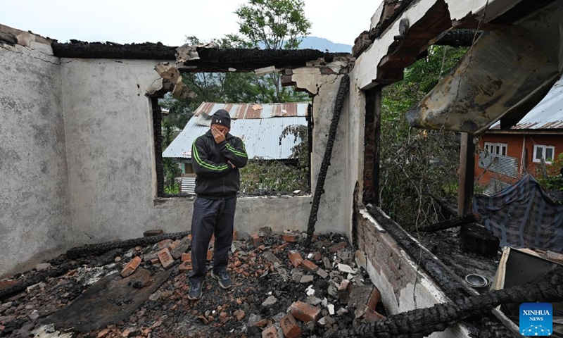 A man cries in his house that was damaged during skirmishes between the troops of India and Pakistan in Salamabad near Line of Control (LoC), about 110 km north of Srinagar city, the summer capital of Indian-controlled Kashmir, May 8, 2025. (Photo: Xinhua)
