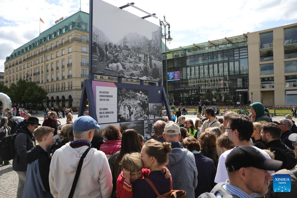 People attend a ceremony commemorating the 80th anniversary of the end of World War II in Europe at the Brandenburg Gate in Berlin, Germany, May 8, 2025. With the unconditional surrender of the Wehrmacht, the unified armed forces of Nazi Germany, World War Two ended on May 8 in 1945 (also known as Victory in Europe Day or VE Day). At least 55 million people had died during the war and around six million Jews had fallen victim to the Nazi's Holocaust throughout Europe. (Photo: Xinhua)