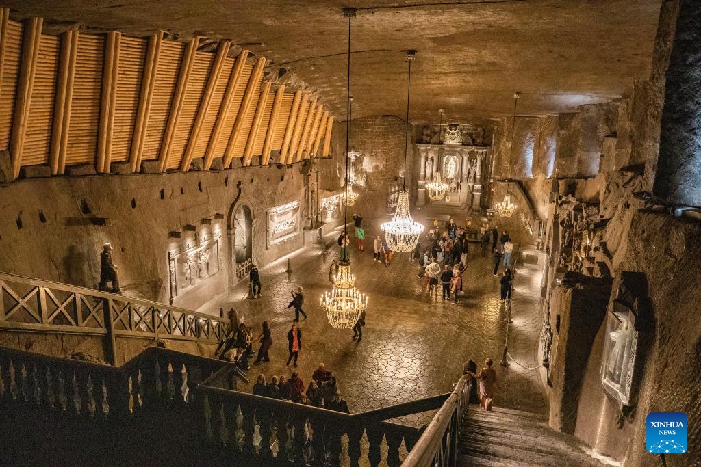 Tourists visit the Wieliczka Salt Mine in Wieliczka, Poland, May 7, 2025. The deposit of rock salt in Wieliczka has been mined since the 13th century. This major industrial undertaking is the oldest of its type in Europe. The Wieliczka Salt Mine illustrates the historic stages of the development of mining techniques in Europe from the 13th to the 20th centuries: the mine has hundreds of kilometers of galleries with works of art, underground chapels and statues sculpted in the salt, making a fascinating pilgrimage into the past. (Photo: Xinhua)