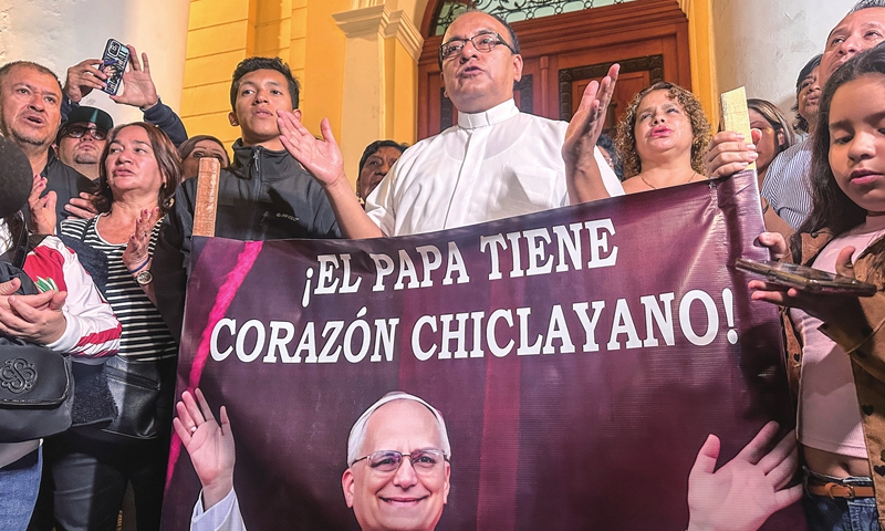 A priest speaks to journalists in the cathedral of Chiclayo, Peru, on May 8, 2025, as Catholics celebrate the election of US-Peruvian Robert Prevost as Pope. He was elected the new pope on the second day of secret ballots in the cardinals' conclave held in Vatican City. The name he chose as the new pope was Leo XIV. Photo: VCG