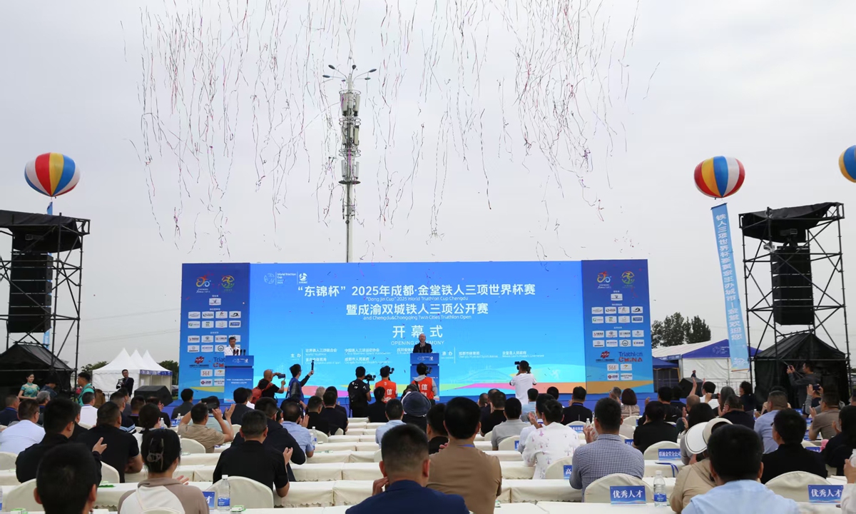 Participants attend the opening ceremony of the Dong Jin Cup 2025 World Triathlon Cup Chengdu and the Chengdu&Chongqing Twin Cities Triathlon Open at the Jintang County International Triathlon venue in Chengdu, Southwest China's Sichuan Province on May 10, 2025. 
