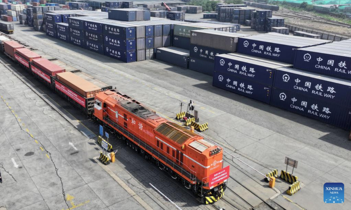 A drone photo shows a China-Central Asia freight train bound for Tashkent via Horgos before its departure from a railway station at Tianjin Port in north China's Tianjin, May 20, 2025. The first China-Central Asia freight train from Tianjin Port to Tashkent via Horgos in 2025 departed here on Tuesday, sending fifty containers of auto parts, mechanical equipment, building materials and household appliances to Uzbekistan's capital. (Xinhua/Zhao Zishuo)