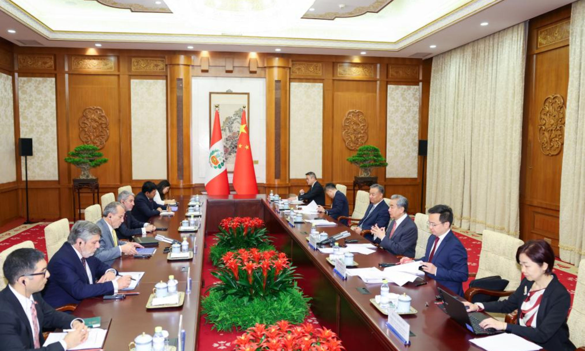 Chinese Foreign Minister Wang Yi, also a member of the Political Bureau of the Communist Party of China Central Committee, meets with Peruvian Foreign Minister Elmer Schialer Salcedo in Beijing, capital of China, May 12, 2025. (Xinhua/Liu Bin)