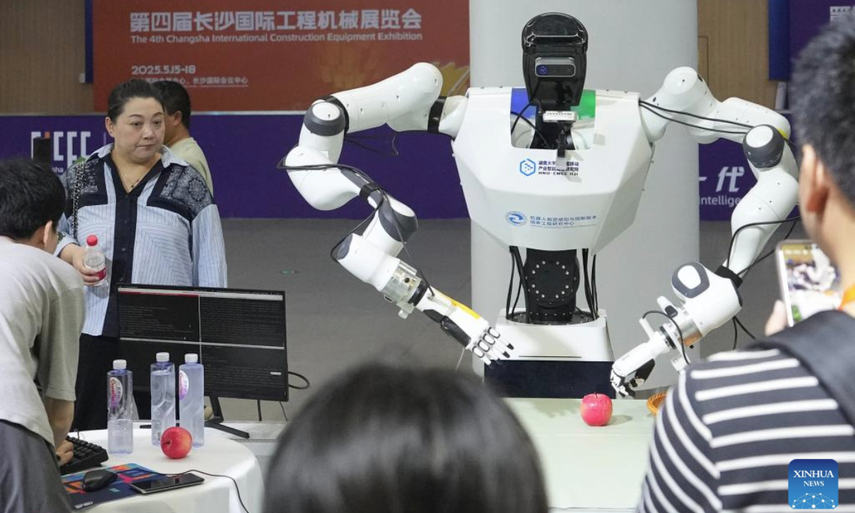 Visitors watch a humanoid robot demonstration during the 4th Changsha International Construction Equipment Exhibition in Changsha, central China's Hunan Province, May 15, 2025. The event is held here from May 15 to 18, featuring new-generation machinery equipment for construction, emergency service, mining, agriculture and transportation, with an exhibition area of 300,000 square meters. (Xinhua/Xue Yuge)