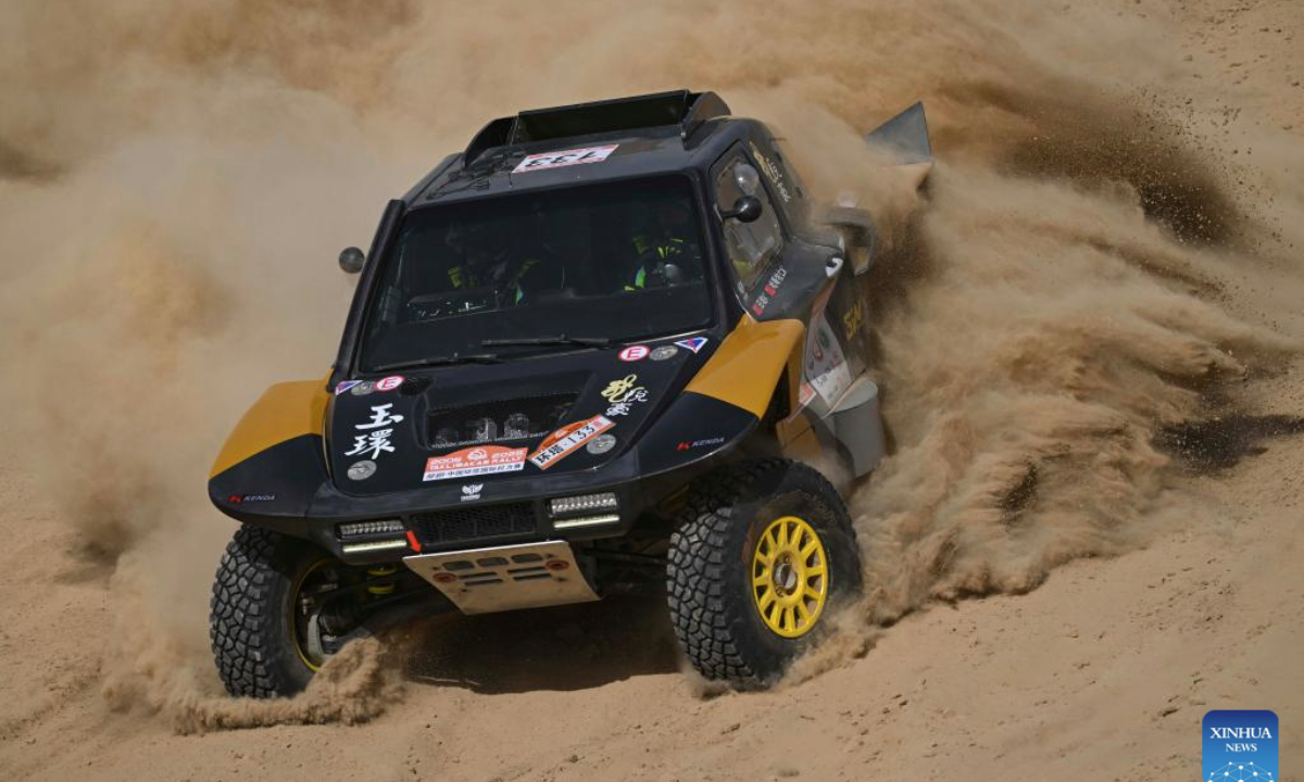 Driver Tian Po and co-driver Hasimuren of China compete during the qualifying race of the 2025 Taklimakan Rally in Aksu, northwest China's Xinjiang Uygur Autonomous Region, May 20, 2025. (Xinhua/Hu Huhu)