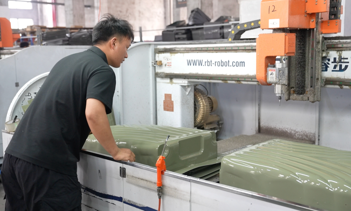 A worker processes a piece of luggage at the factory of Ningbo AT Import & Export Co., Ltd. In Ningbo, East China's Zhejiang Province, on May 16, 2025. Photo: Zhang Yashu/GT