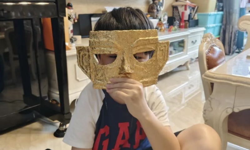 Lu Yushao, a primary school student from Ningbo city, east China's Zhejiang Province, draws attention and compliment from netizens for his stunning set of miniature Sanxingdui relic replicas on May 17, 2025. Photo: Xinhua