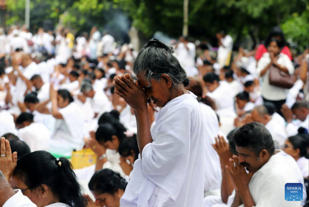 People participate in a celebration of Vesak Day in Colombo, Sri Lanka, on May 12, 2025. (Photo by Ajith Perera/Xinhua)