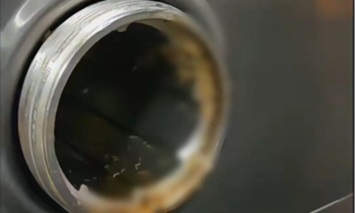 Photo: Video screenshot released by parents showing live maggots in the meat grinder