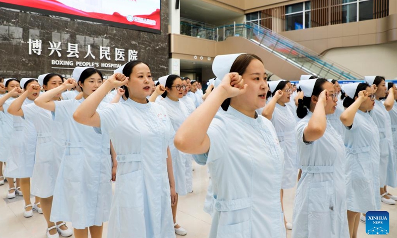 Nurses participate in an oath-taking event at Boxing County People's Hospital in Boxing County, Binzhou, east China's Shandong Province, May 9, 2025. International Nurses Day, which falls annually on May 12, have recently been observed across China in various forms. (Photo by Chen Bin/Xinhua)