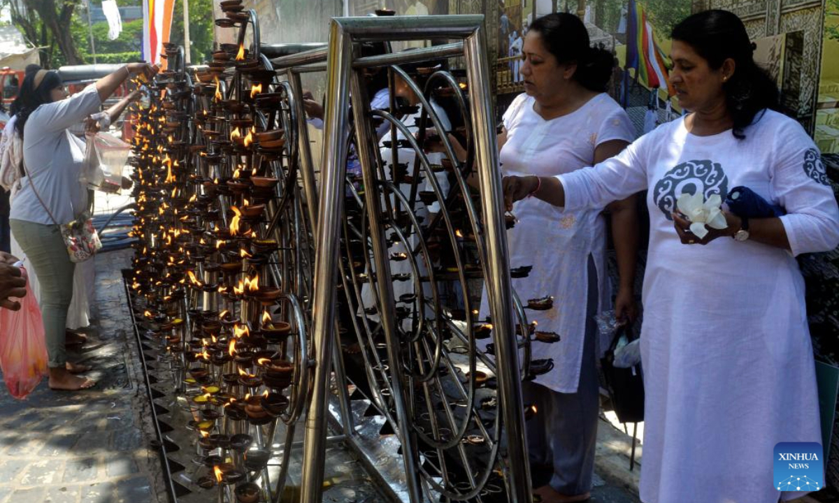 People participate in a celebration of Vesak Day in Colombo, Sri Lanka, on May 12, 2025. (Photo by Gayan Sameera/Xinhua)