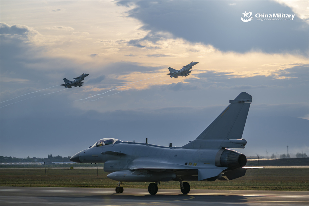 J-10 fighter jets attached to a unit under the Chinese PLA Air Force take off in succession during a round-the-clock flight training exercise, aiming to test the pilots' cooperative combat capabilities. (eng.chinamil.com.cn/Photo by Xiao Rui)
