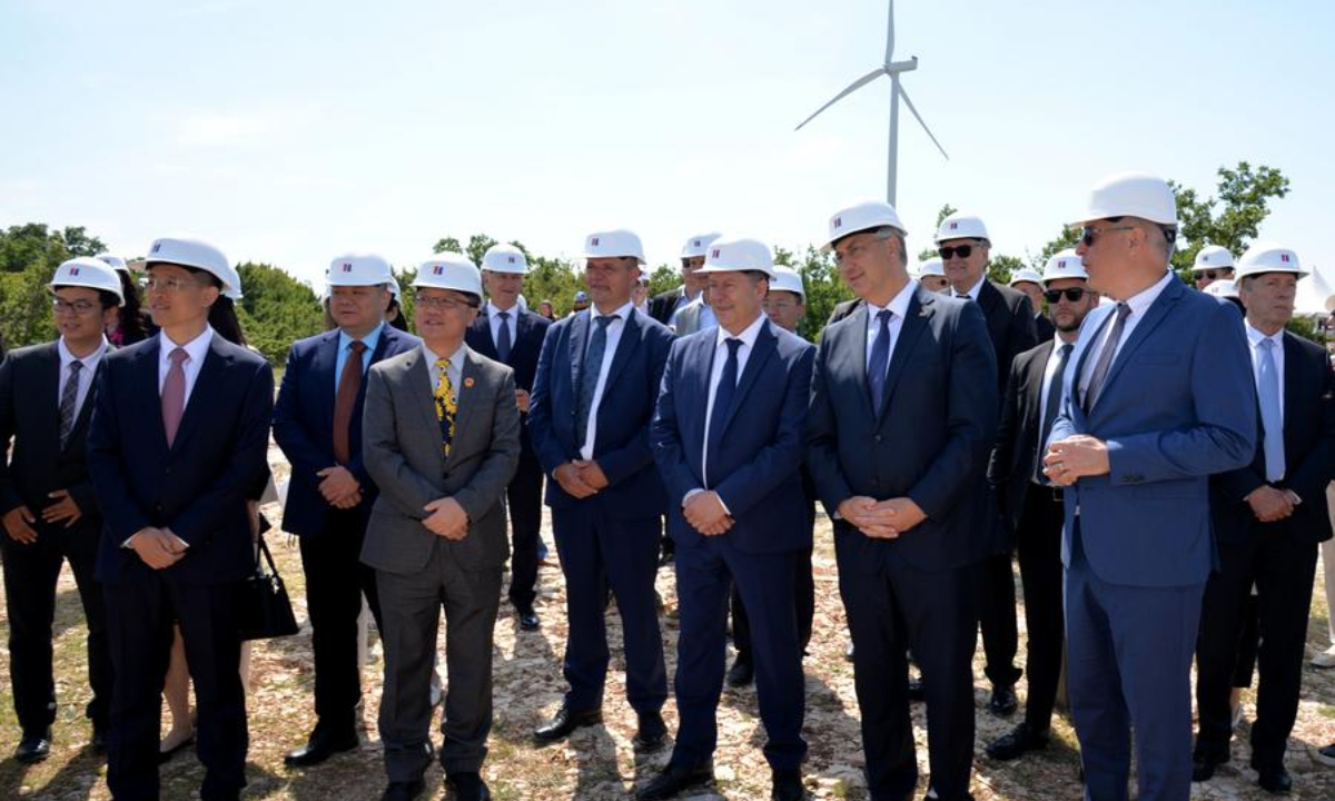 Croatian Prime Minister Andrej Plenkovic (2nd R, Front) and Chinese Ambassador to Croatia Qi Qianjin (2nd L, Front) visit the construction site of the Korlat solar project in Korlat, Croatia, on May 15, 2025.  (Xinhua/Li Xuejun)