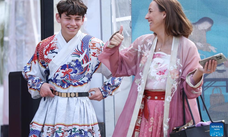 People try traditional Chinese attire during the Tea for Harmony cultural salon in Auckland, New Zealand, May 11, 2025. The cultural salon on tea was held on Sunday at the picturesque Howick Historical Village in New Zealand's largest city Auckland, inviting guests and local residents to immerse themselves in the richness of traditional Chinese culture while promoting dialogue and friendship between China and New Zealand. (Xinhua/Long Lei)