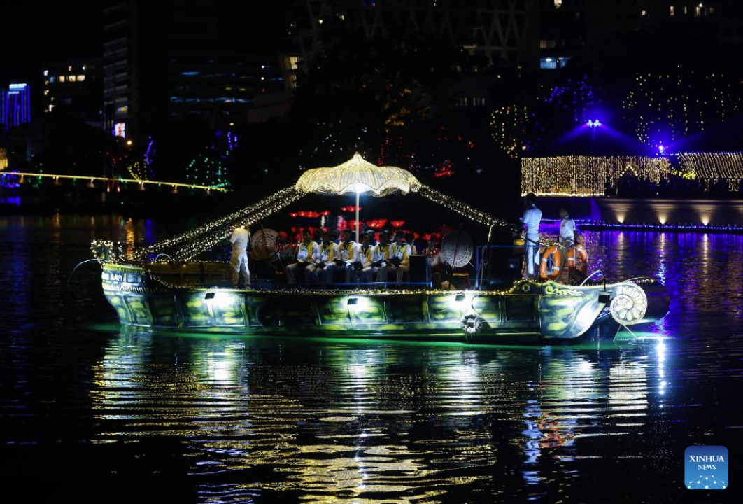 People take part in a celebration of Vesak Day on a decorated boat in Colombo, Sri Lanka, on May 12, 2025. (Photo by Ajith Perera/Xinhua)