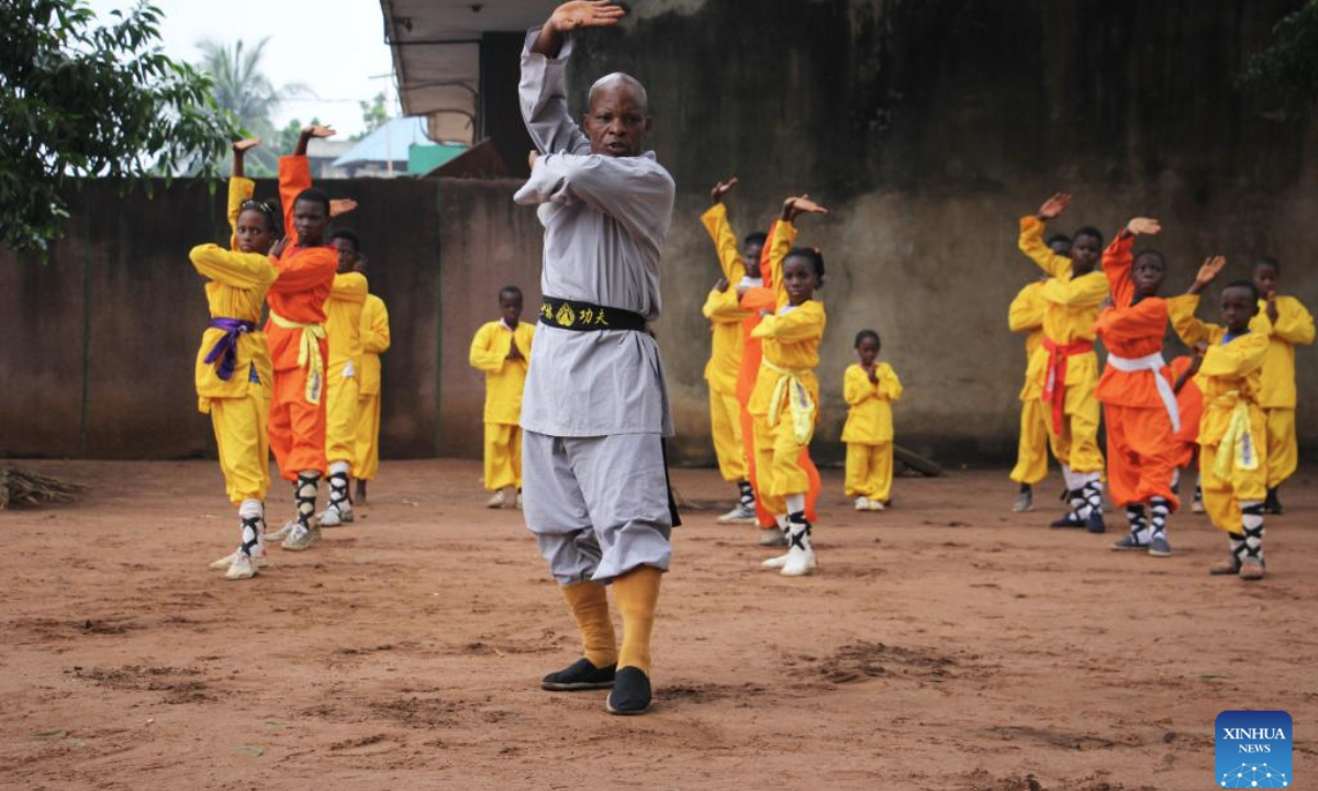 Damien Agossou Degbo (front) instructs his students at his martial arts club in Akpro-Misserete, a town some 40 kilometers northeast of Benin's economic capital Cotonou, on May 18, 2025.(Photo by Seraphin Zounyekpe/Xinhua)