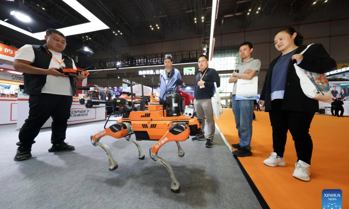 A staff member demonstrates to visitors a quadruped robot dog that can be used for emergency rescue at the booth of Beijing Topsky Intelligent Equipment Group Co., Ltd. during the fourth Yangtze River Delta International Emergency Disaster Reduction and Rescue Expo in Shanghai, east China, May 13, 2025. Over 3,000 cutting-edge equipment and technologies are on display at the expo.

With an exhibition area of approximately 60,000 square meters, this year's expo, which runs from Tuesday to Thursday, has attracted over 500 leading companies from nearly 20 countries and regions. (Xinhua/Wang Xiang)