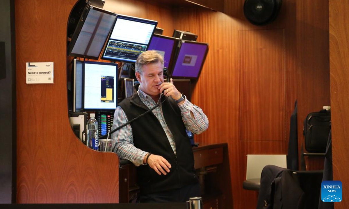 A trader talks on a phone on the floor of the New York Stock Exchange in New York, the United States, on May 12, 2025. U.S. stocks rallied sharply on Monday after the United States and China announced a temporary rollback of reciprocal tariffs, providing much-needed relief to investors concerned about the escalating trade war's economic fallout. The Dow Jones Industrial Average rose 1,160.72 points, or 2.81 percent, to 42,410.1. The S&P 500 added 184.28 points, or 3.26 percent, to 5,844.19. The Nasdaq Composite Index increased 779.43 points, or 4.35 percent, to 18,708.34. (Xinhua/Liu Yanan)