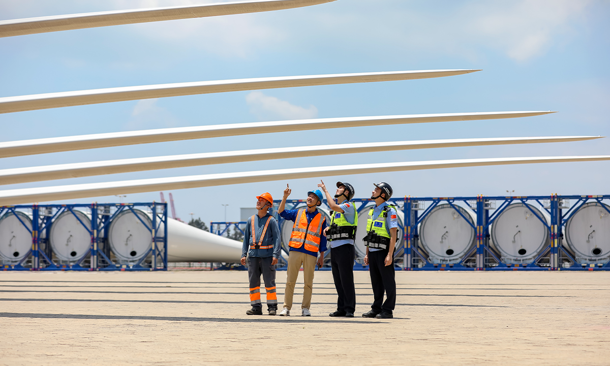 Immigration officers from the Fuqing border inspection station in Fuzhou, East China's FujianProvince, examine the wind power equipment at a turbine hoisting and storage yard on May 13, 2025. Photo: VCG