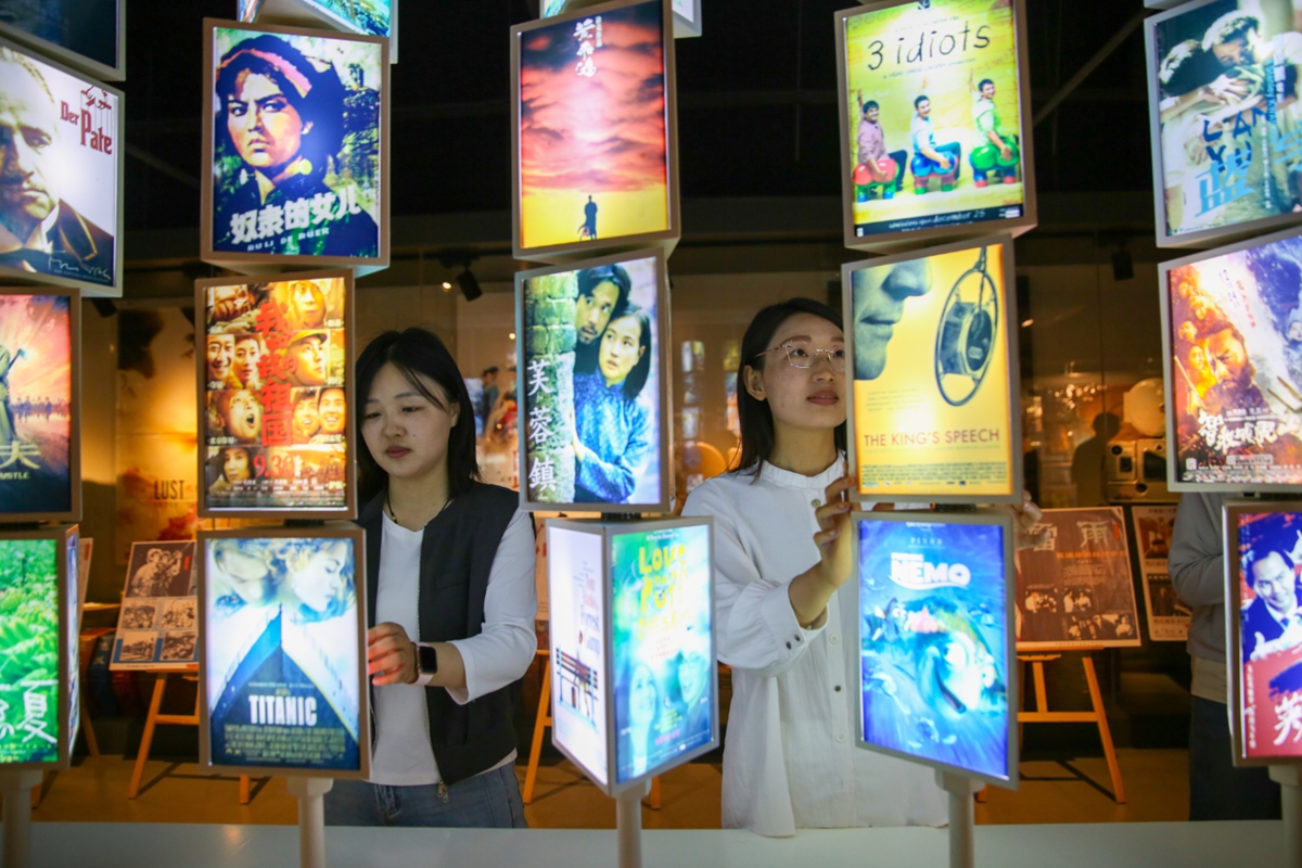 Visitors look at posters for classic films at the Huaxia Film Museum in Rugao, East China's Jiangsu Province, on May 14, 2025. The museum houses over 200,000 items, including film reels, film processing and restoration equipment, projection devices, scripts, and vintage film collectibles. Photo: VCG