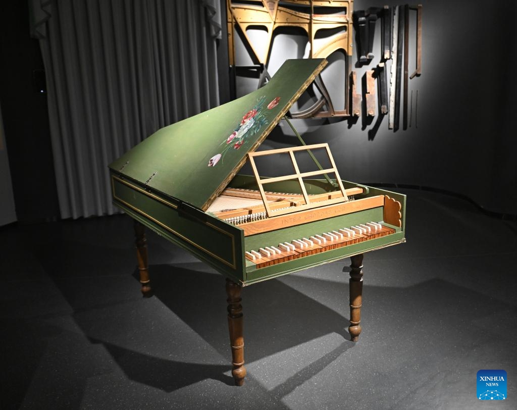 This photo taken on May 8, 2025 shows an antique piano displayed at the Chengdu Xin Smart Music Museum in Chengdu, southwest China's Sichuan Province. Chengdu Xin Smart Music Museum, home to a collection of over 300 instruments from all over the world, is designed to enable an immersive experience for visitors. With technologies such as 3D imaging, holographic theatres, and digital scene restoration, it reflects virtual historical scenarios, tells stories behind music works, and sheds light on technology innovations in those instruments. The museum has received about 50,000 visitors in since it opened on April 30, 2024. (Photo: Xinhua)