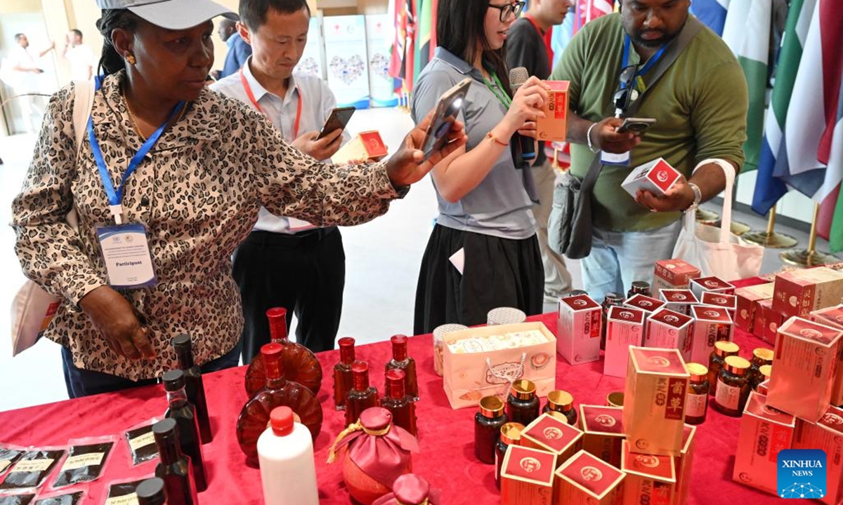 Guests learn about Juncao products at the National Engineering Research Center of Juncao Technology of the Fujian Agriculture and Forestry University in Fuzhou, southeast China's Fujian Province, May 17, 2025. Chinese and foreign guests attending the 20th International Conference on Juncao Industry Development learned about the development of Juncao industry in Fujian and exchanged experience. (Xinhua/Lin Shanchuan)