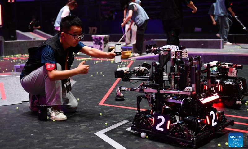 Contestants from Hefei University of Technology test their robots during the RoboMaster 2025 University Championship Regional Competition in Changsha, central China's Hunan Province, May 21, 2025. The five-day regional competition kicked off here on Wednesday, attracting teams from 32 universities of China. (Xinhua/Chen Zhenhai)