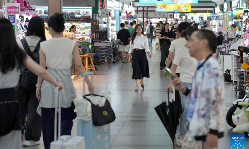 Sun Lijuan is pictured at the Yiwu International Trade Mart in Yiwu, east China's Zhejiang Province, May 20, 2025. 