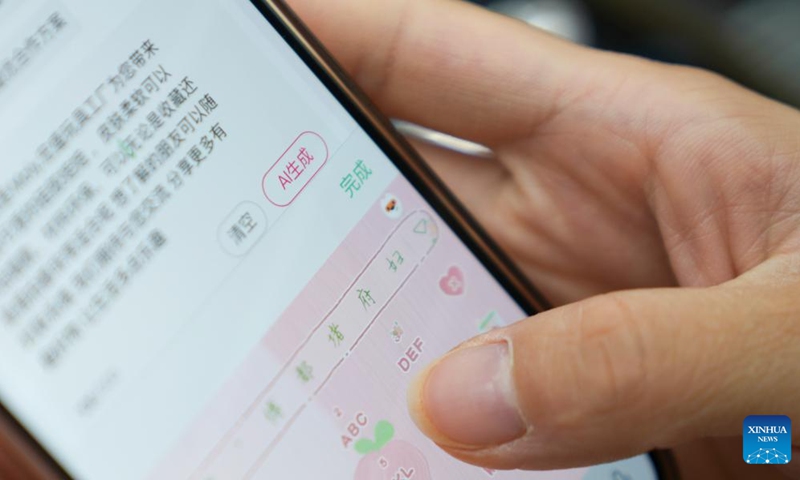 A colleague of Sun Lijuan writes the script for a product-selling video with the help of an AI tool at the Yiwu International Trade Mart in Yiwu, east China's Zhejiang Province, May 20, 2025.(Xinhua/Han Chuanhao)