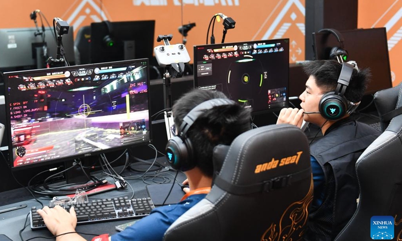 Contestants from Hefei University of Technology operate their robots during the RoboMaster 2025 University Championship Regional Competition in Changsha, central China's Hunan Province, May 21, 2025. The five-day regional competition kicked off here on Wednesday, attracting teams from 32 universities of China. (Xinhua/Chen Zhenhai)