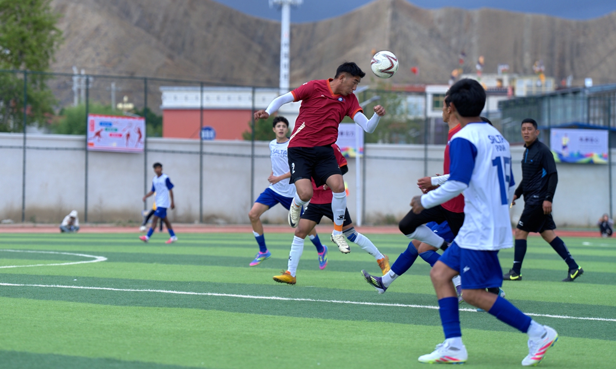 Players vie for a header during a friendly football match between the Qomolangma Snow Eagles and the Salta delegation team in Xigaze, Southwest China's Xizang Autonomous Region, on May 20, 2025. Photos on this page: Courtesy of Xigaze publicity department