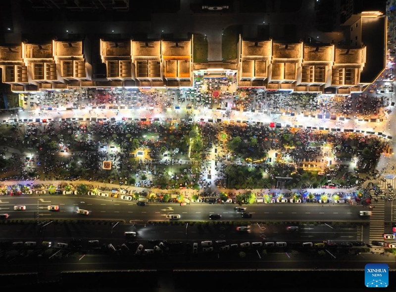 An aerial drone photo shows a night market in Wuzhou, south China's Guangxi Zhuang Autonomous Region, May 1, 2025. In recent years, Guangxi has been continuously focusing on the upgrade of consumption experience and promoting the integration of cultural tourism and commerce. Various night fairs and booths have boosted consumption and injected vitality into the night economy. Photo: Xinhua