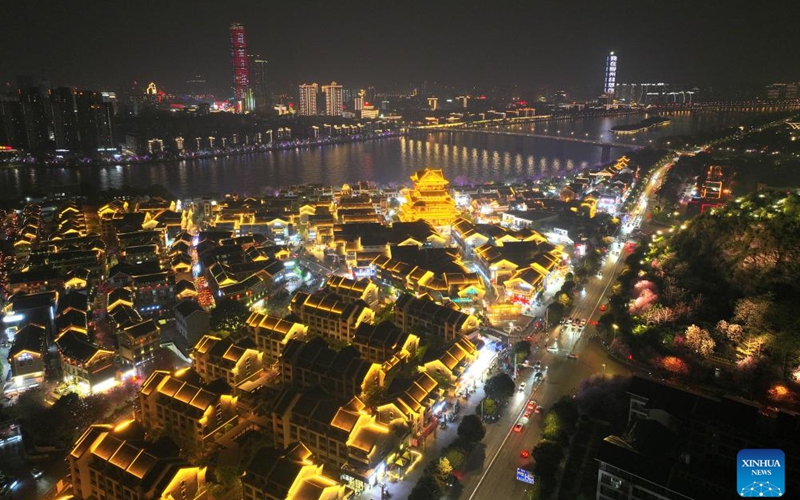 A drone photo shows a night view of Yaobu ancient town in Liuzhou, south China's Guangxi Zhuang Autonomous Region, April 8, 2025. In recent years, Guangxi has been continuously focusing on the upgrade of consumption experience and promoting the integration of cultural tourism and commerce. Various night fairs and booths have boosted consumption and injected vitality into the night economy. Photo: Xinhua