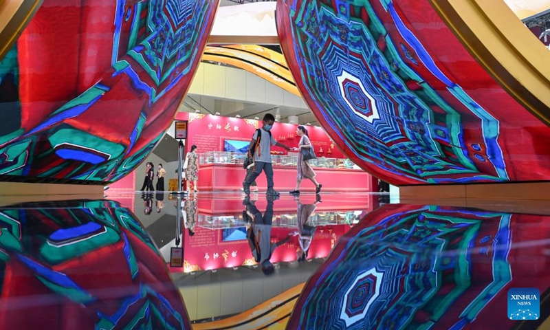 Children walk past a screen at the exhibition area of Beijing during the 21st China (Shenzhen) International Cultural Industries Fair in Shenzhen, south China's Guangdong Province, May 24, 2025. Opened here on Thursday, the five-day event is being held across eight exhibition halls -- three comprehensive spaces and five specialized areas. Activities related to traditional culture and cultural heritages attracted many young visitors. Photo: Xinhua