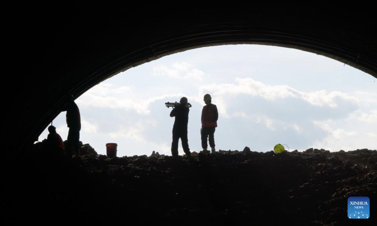 Staff members work at the construction site of a tunnel along a railway linking Suifenhe and China's border with Russia in Suifenhe, northeast China's Heilongjiang Province, May 27, 2025. Construction of this 602-meter railway tunnel started last May and was completed on Wednesday. The new tunnel will significantly boost line capacity of a railway linking Suifenhe and the China-Russia border, which is under renovation with a designed speed of 120 kilometers per hour. (Xinhua/Wang Song)