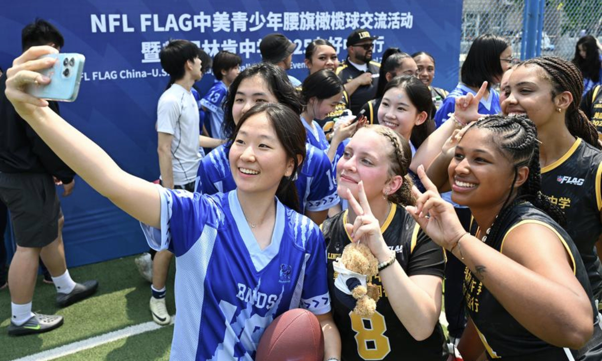 Students of Lincoln High School and Beijing National Day School compete during the NFL FLAG China-U.S. Youth Flag Football Exchange Event & Lincoln High School 2025 China Tour at Beijing National Day School in Beijing, capital of China, May 26, 2025. (Xinhua/Li He)