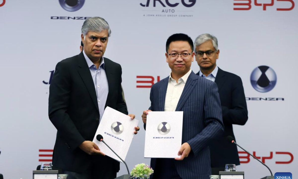 Representatives of BYD and John Keells CG Auto show MoUs to facilitate BYD's premium luxury brand DENZA's entry into the local market in Colombo, Sri Lanka, on May 27, 2025. BYD, a Chinese new energy vehicle (NEV) maker, is expanding its footprint in Sri Lanka with plans to introduce DENZA, its premium luxury brand, through local distributor John Keells CG Auto. (Photo by Ajith Perera/Xinhua)