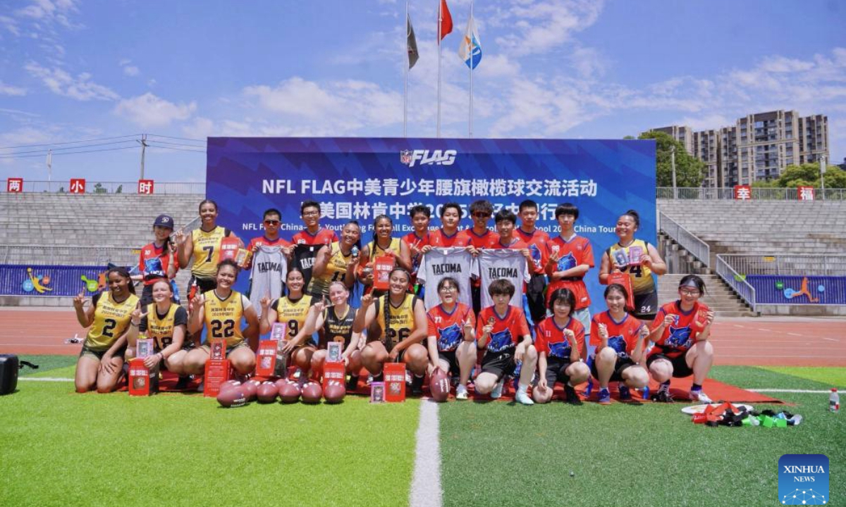 Students of Lincoln High School and Chengdu Foreign Languages School pose for a group photo during the NFL FLAG China-U.S. Youth Flag Football Exchange Event & Lincoln High School 2025 China Tour in Chengdu, southwest China's Sichuan Province, May 28, 2025. The team is in China for the sports and cultural exchange activities between Chinese and American youth at the invitation of the Chinese People's Association for Friendship with Foreign Countries. (Xinhua)