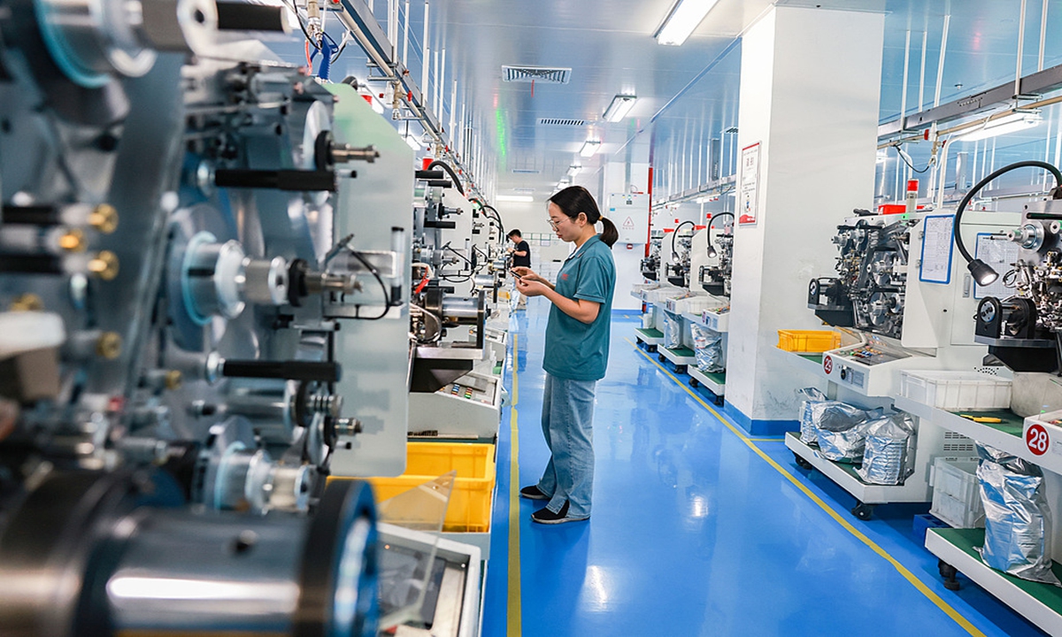 Workers at a production workshop in the economic development zone of Sansui county, Southwest China's Guizhou Province, rush to fill electronic component orders on May 26, 2025. In recent years, the county has continued to improve its business environment and foster industrial innovation through technological advancement, driving new momentum for intelligent manufacturing.