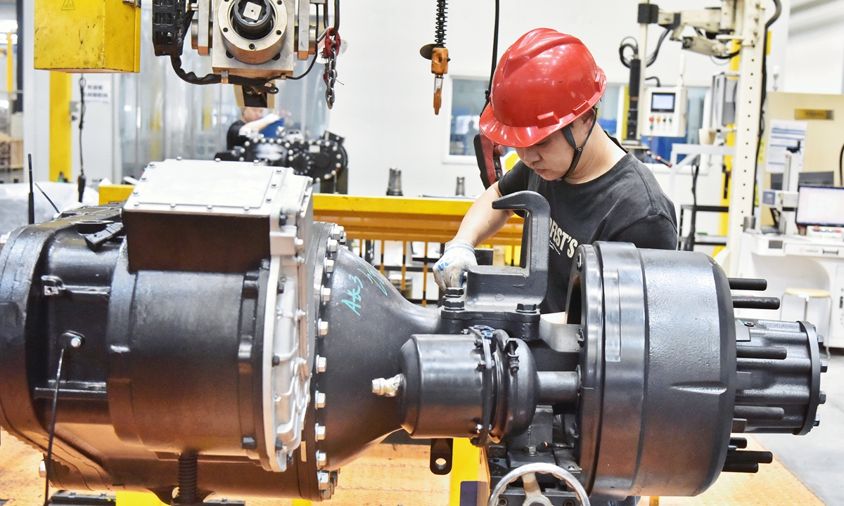 A worker is busy fulfilling an order for new-energy vehicle parts bound for Brazil, at a smart production workshop in a composite materials company in Nantong, East China's Jiangsu Province on May 27, 2025. 
Photo: VCG