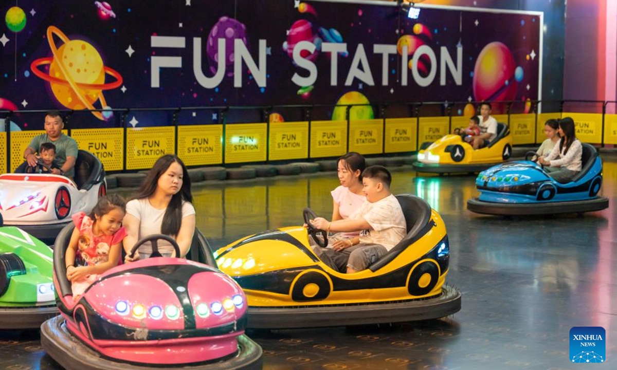 Children play at an amusement park to celebrate the International Children's Day in Vientiane, Laos, June 1, 2025. (Photo by Kaikeo Saiyasane/Xinhua)