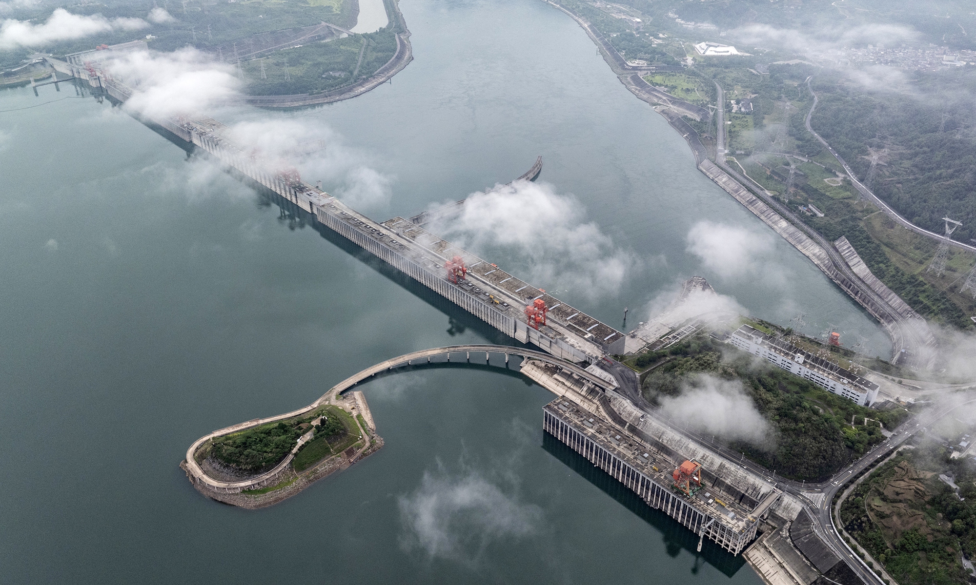Mist and clouds shroud the Three Gorges Dam in Yichang, Hubei Province, on June 2, 2025. Over the past seven years, the Three Gorges Navigation Authority has conducted 100 percent safety inspections on all vessels passing through the Three Gorges ship locks and ship lifts, cumulatively inspecting over 350,000 ships. These efforts have ensured the safe passage of more than 1.077 billion tons of cargo and over 8.57 million passengers through the Three Gorges hub. Photo: VCG