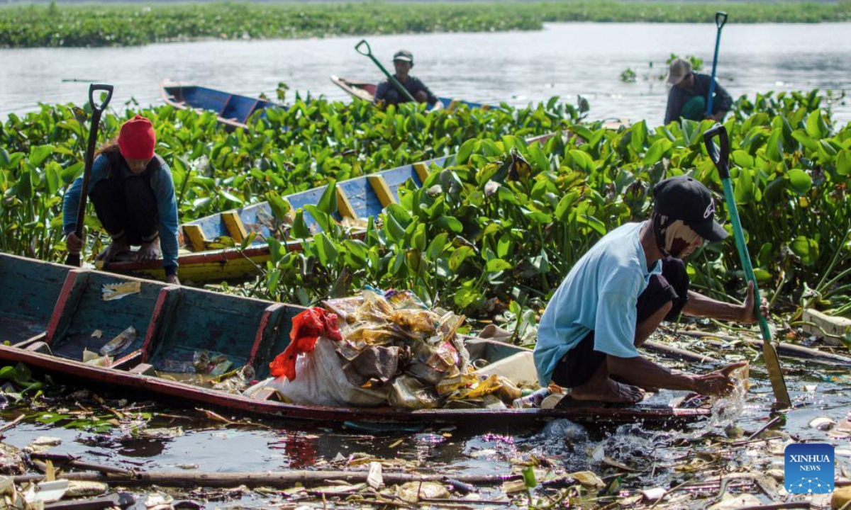People sort and collect plastic garbage as a part of a campaign marking the upcoming World Environment Day, observed annually on June 5, on Citarum River in West Bandung Regency, West Java, Indonesia, June 4, 2025. (Photo by Septianjar Muharam/Xinhua)