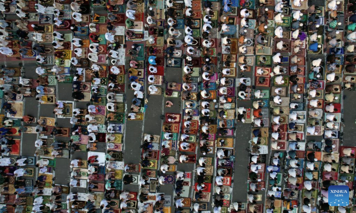 An aerial drone photo shows people performing Eid al-Adha prayer at Jatinegara in Jakarta, Indonesia on June 6, 2025. (Xinhua/Veri Sanovri)