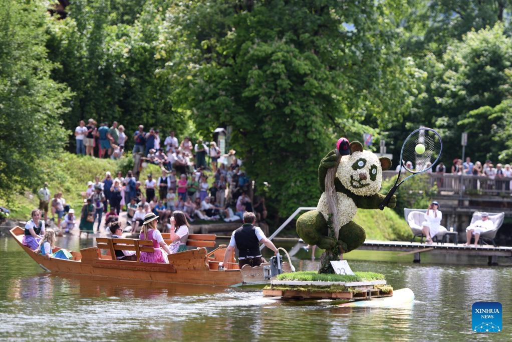 People attend a float parade on water during the Daffodil Festival in Altaussee, Austria, on June 1, 2025. (Xinhua/He Canling)